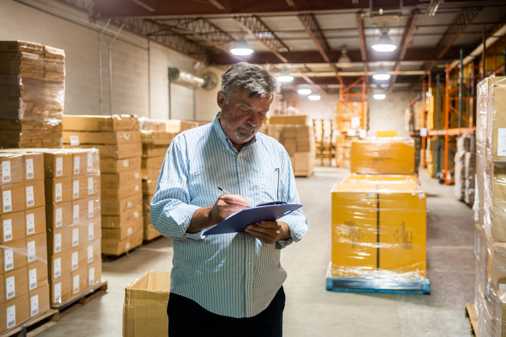 Bulk disposable coffee cups checked with inventory records for wholesale purchasing