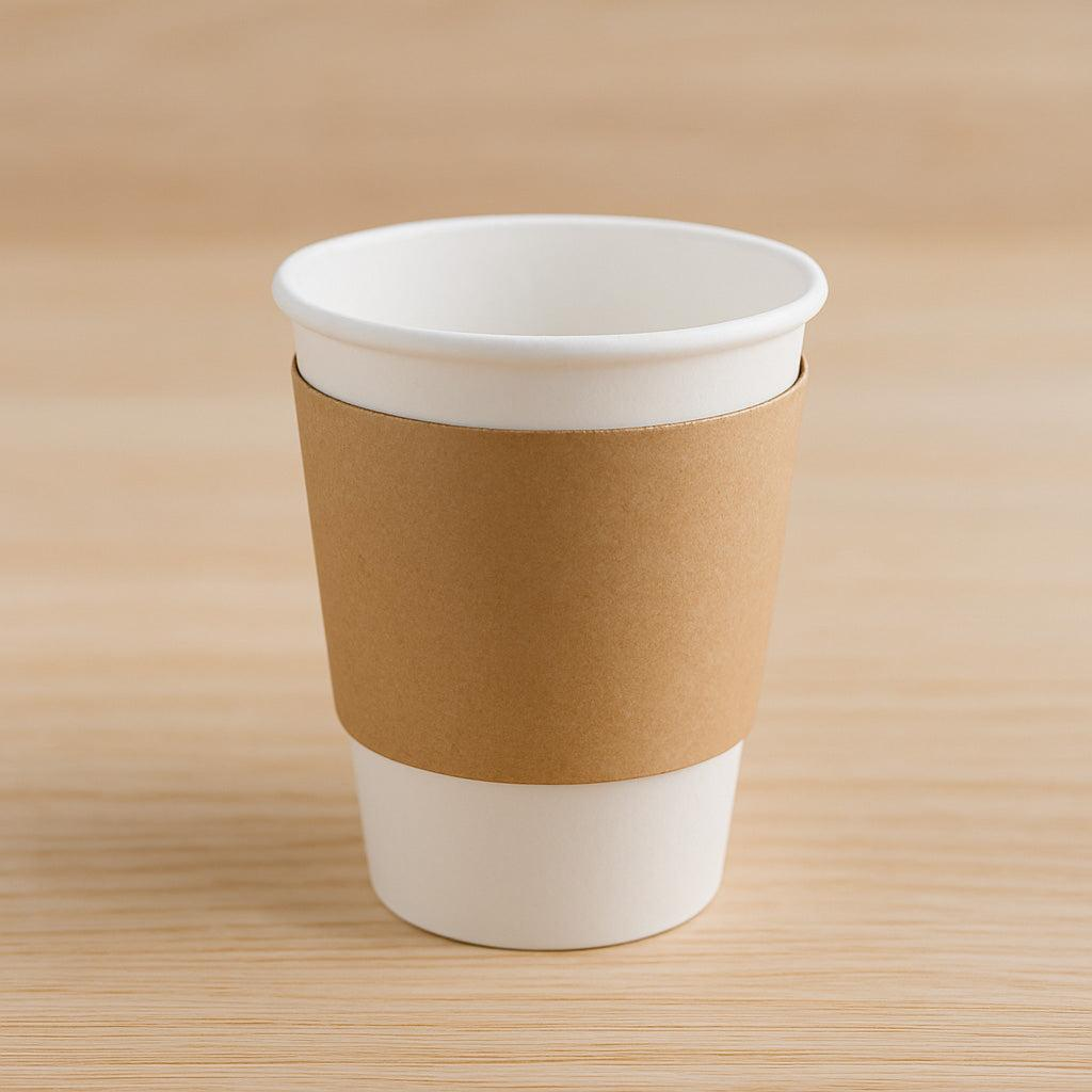 Kraft paper cup sleeve beside a takeaway coffee cup